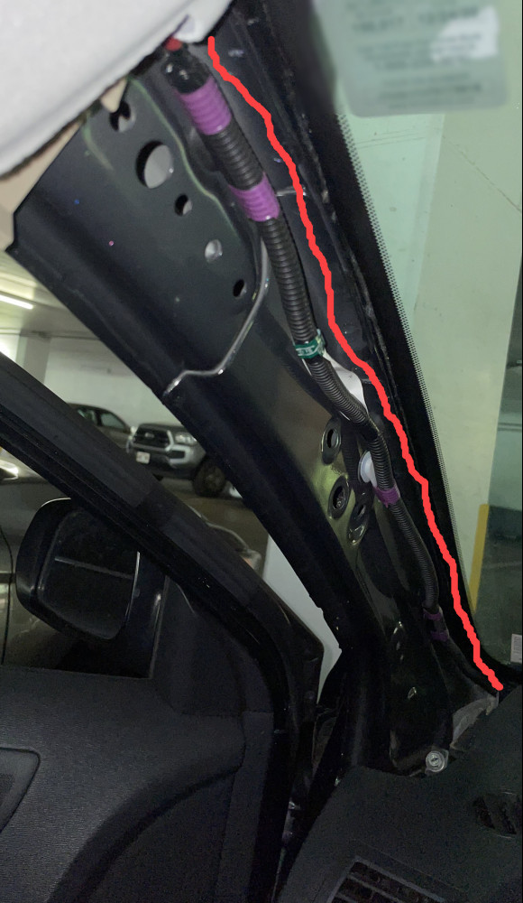 Image showing the driver's side A pillar trim removed to run the rear dash cam cable for a Viofo A129 Pro Duo dash cam.