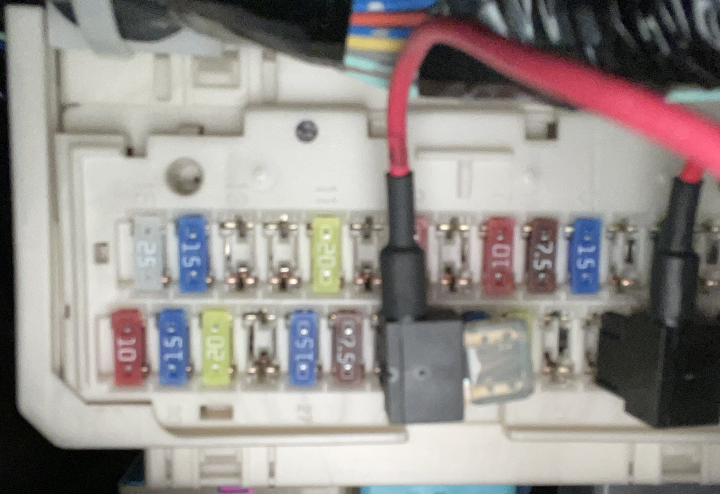 A picture of a fuse box with an add-a-circuit installed.